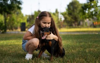child with a doberman one of the most commonly bought protection pets