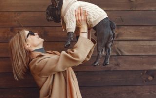 stress-free mother's day with a mother holding her dog up in the air