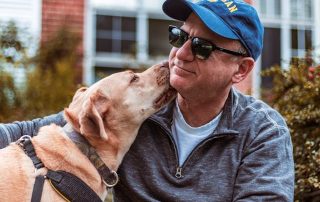 father's day gift ideas for a dog loving dad with his dog nuzzling his neck